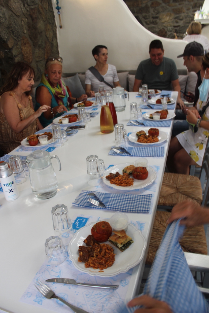 Apex guests sit down for lunch after the cooking class