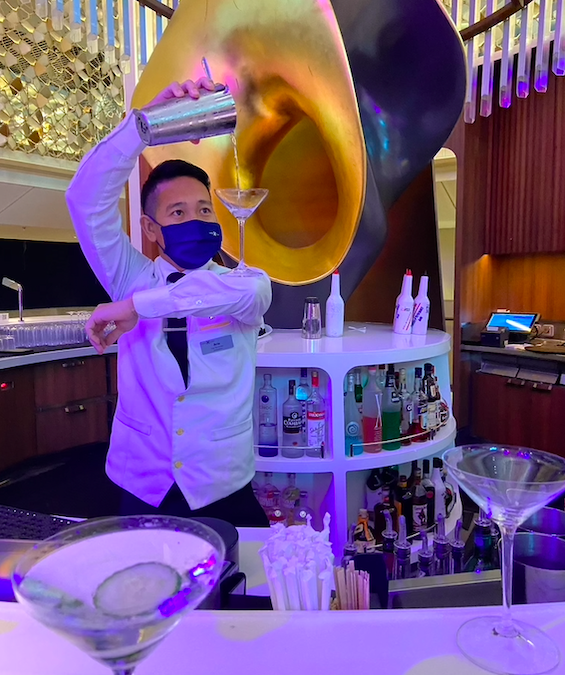A bartender on the Celebrity Apex - all crew are masked at all times during the cruise