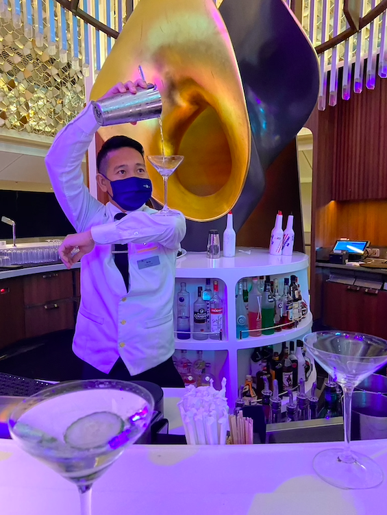 A bartender on the Celebrity Apex - all crew are masked at all times during the cruise