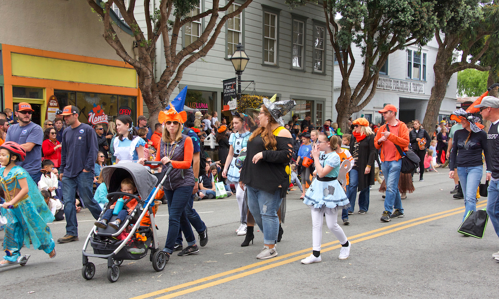 Half Moon Bay, CA - Oct 19, 2019: Unidentified participants in the 49th annual Art and Pumpkin Festival Parade down Main Street in the World Pumpkin Capitol of Half Moon Bay.