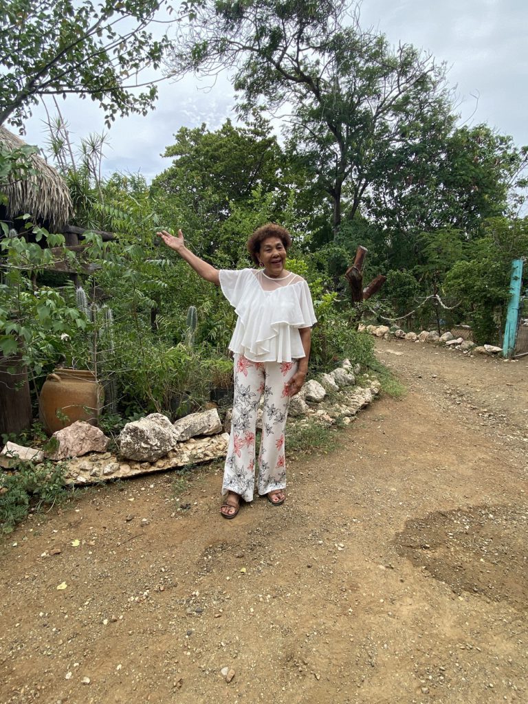 Octogenarian Dinah Veeris in her herb garden on Curacao