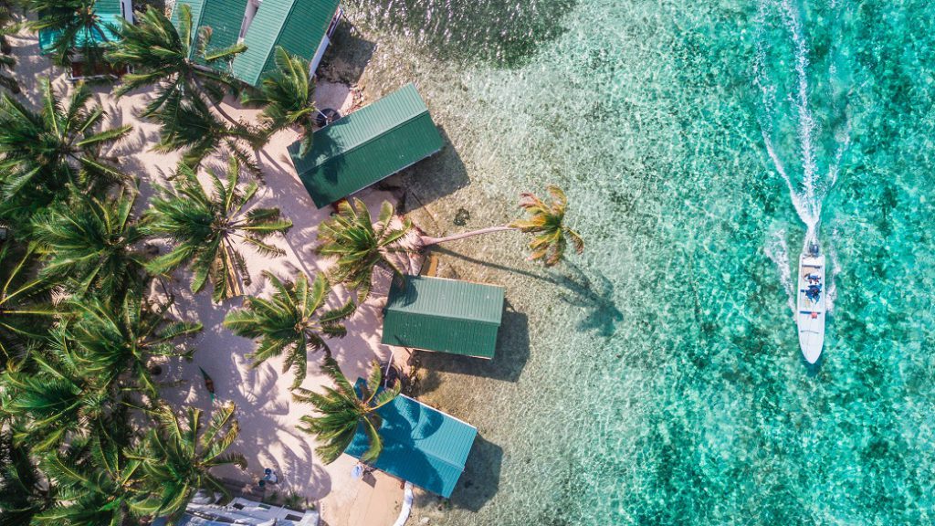 Aerial drone view of Tobacco Caye small Caribbean island in Belize Barrier Reef.