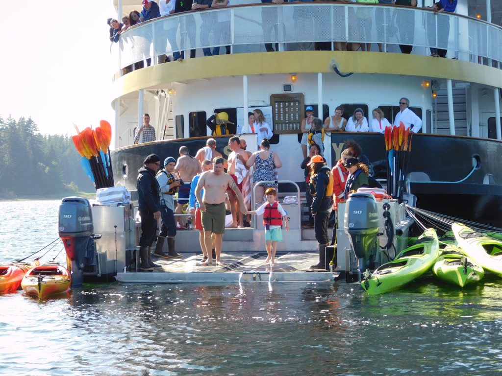 Like father, like son - taking the "polar plunge" from an UnCruise ship in Alaska