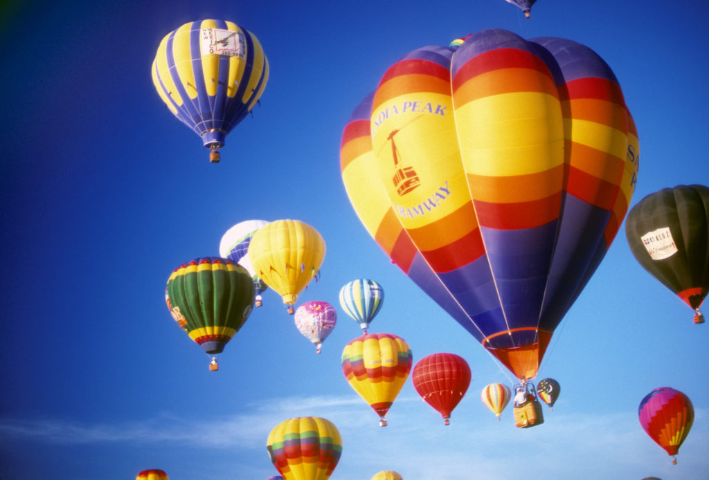 Hot air balloons against blue sky, International Balloon Festival, Albuquerque, New Mexico.