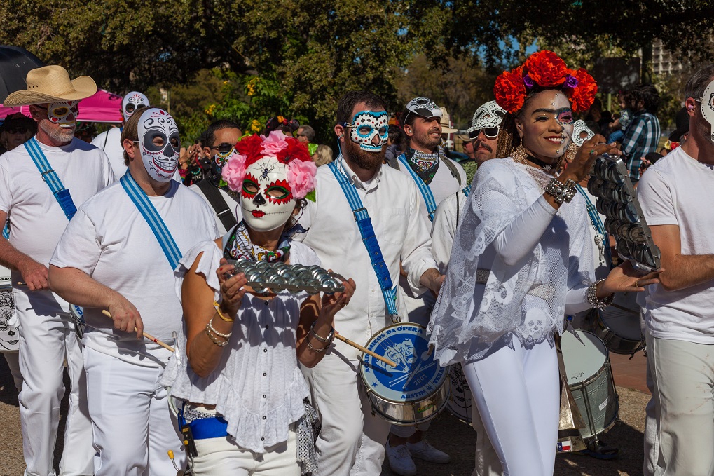 People dance in the traditional procession for the Day of the Dead/Dia de los Muertos celebrations