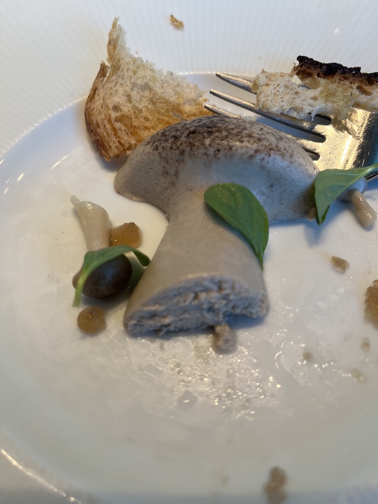 Mushroom pate appetizer in the Test Kitchen aboard Virgin Voyages Valiant Lady