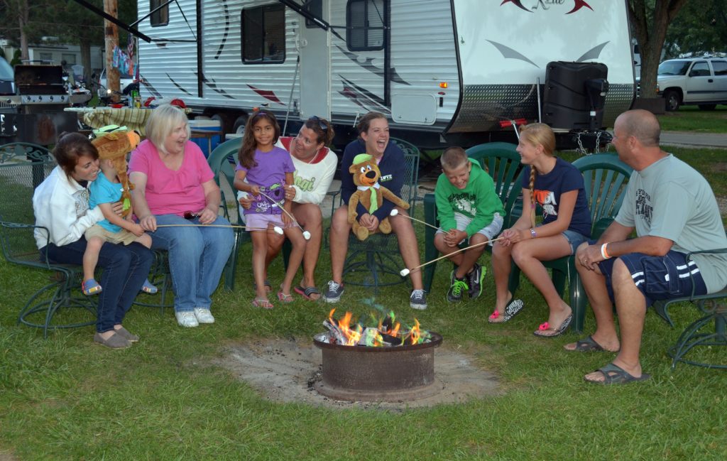 Smores by the fire pit in a Camp Jellystone