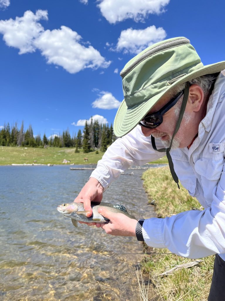 And Andy enjoys catching and releasing a trout in the lake