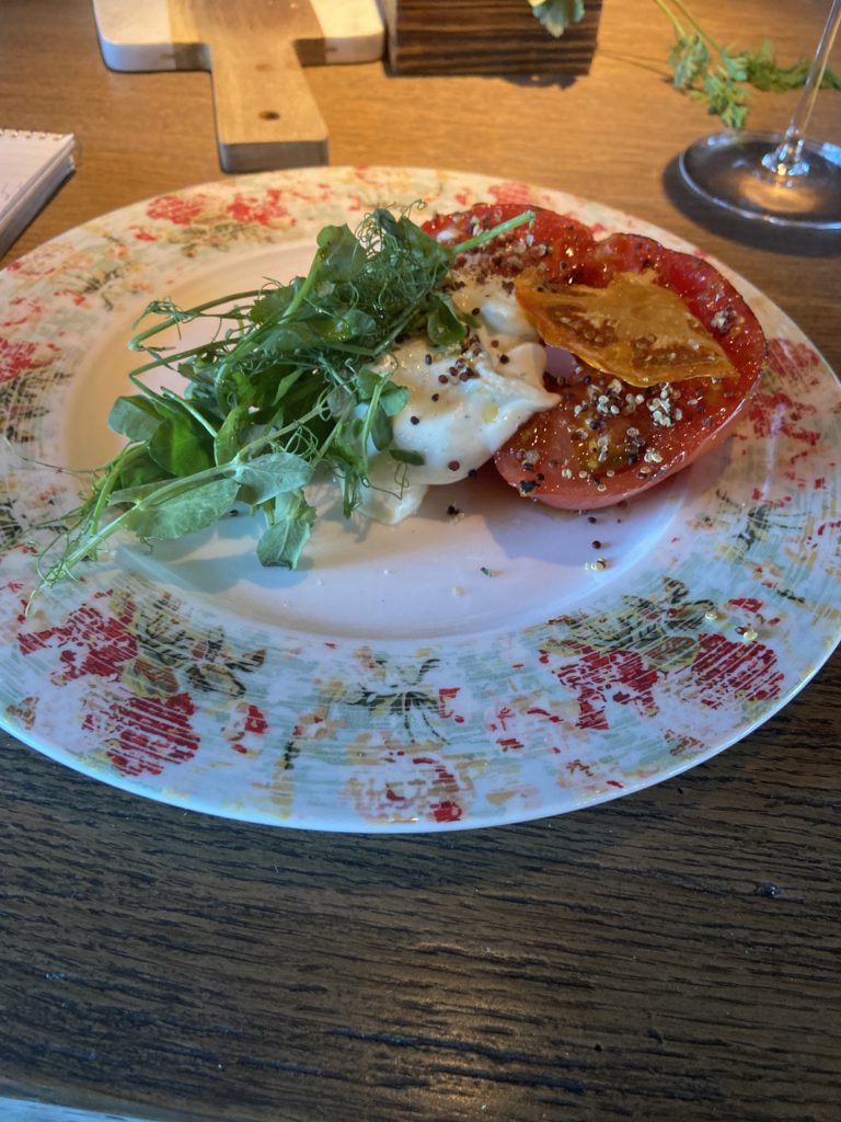 Delicious stuffed from-the-greenhouse tomato salad at the Cheyenne Club on Brush Creek Ranch, Wyoming