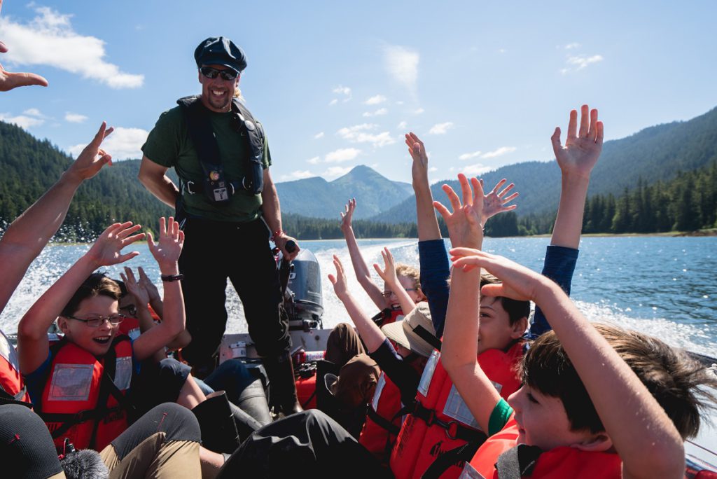 Kids enjoying a skiff ride on an UnCruise Adventure in Alaska