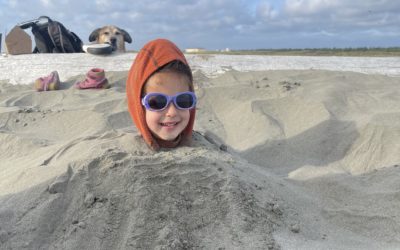 Burying my daughter on the beach Ocean City State Park. Credit: Lindsey Scot Ernst