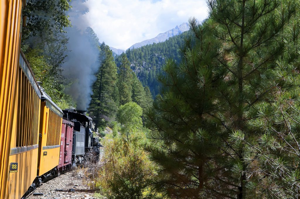 The Narrow Gauge Railway from Durango to Silverton that runs through the Rocky Mountains by the River Animas In Colorado USA