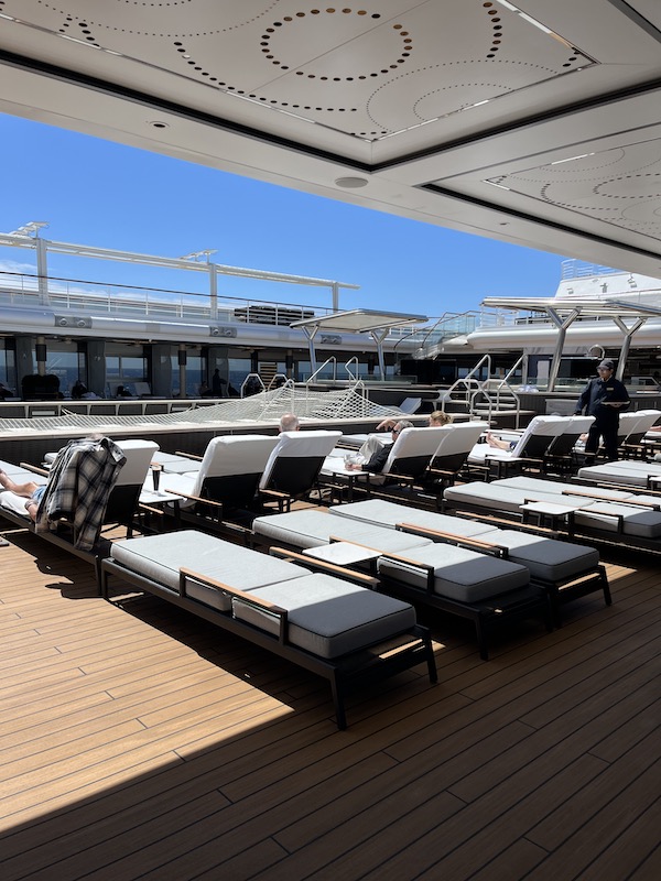 Sunshine bathes the pool deck on the Regent Seven Seas Grandeur on transatlantic crossing