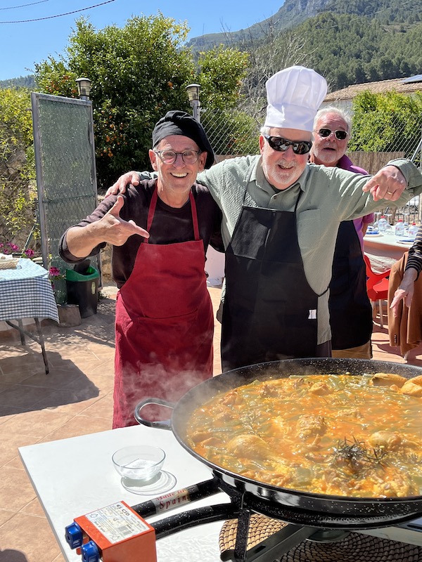 Looks like we did it, Pop. Says one chef to another at the Paella cookout near Valencia