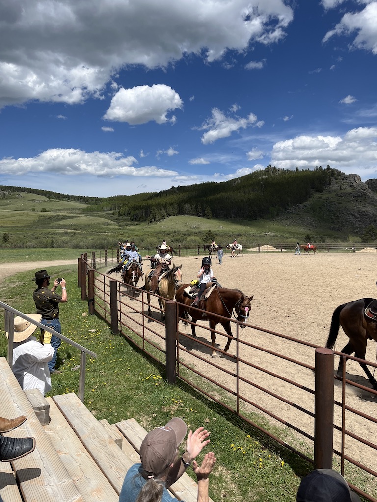 The kids enter the rodeo arena at Paradise Guest Ranch