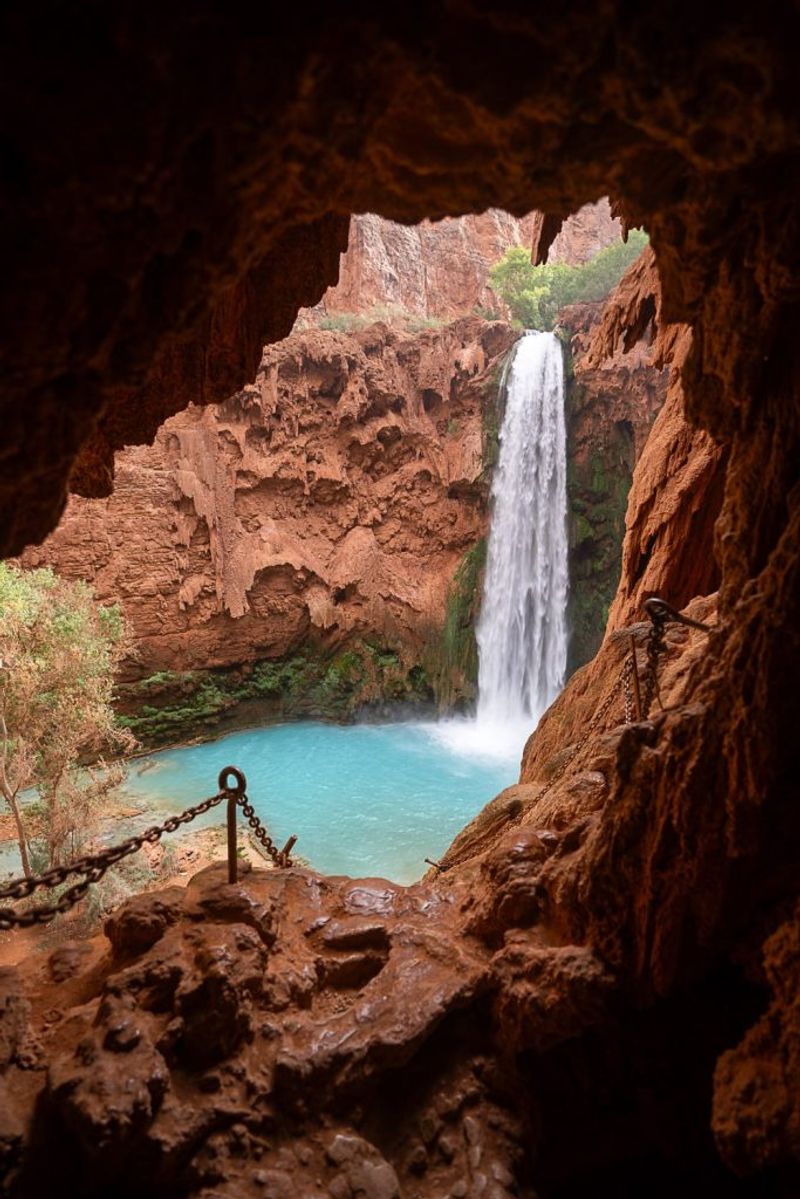 Mooney Falls: A 200-Foot Drop Reached By Chains, Caves, And Ladders
