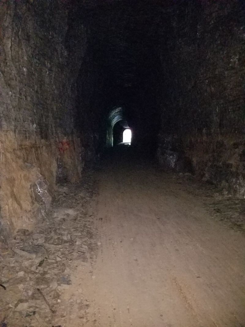 A Hand-Carved Limestone Passage That Stretches Into Total Darkness