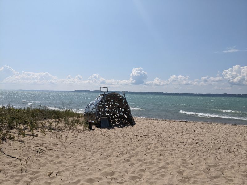 Elk Rapids Day Park Offers Quiet Beaches, Forest Trails, And An Outdoor Sculpture Walk