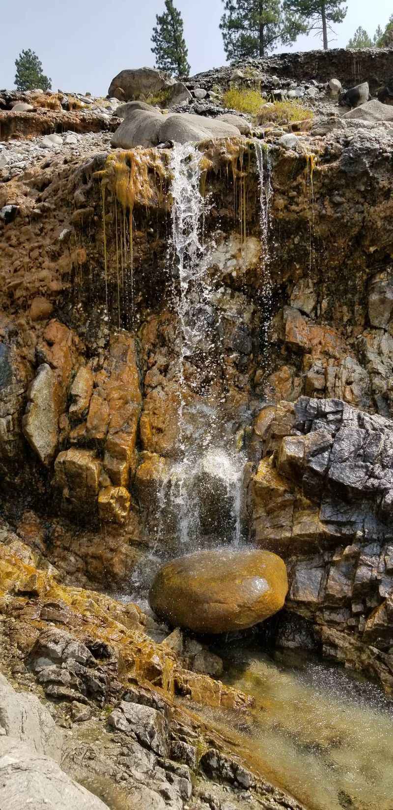 Natural Cliffside Pools Fed by Steaming Waterfalls