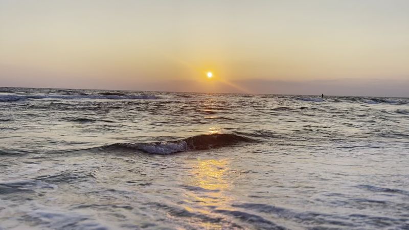 A Sunrise-And-Sunset Peninsula Surrounded By Water