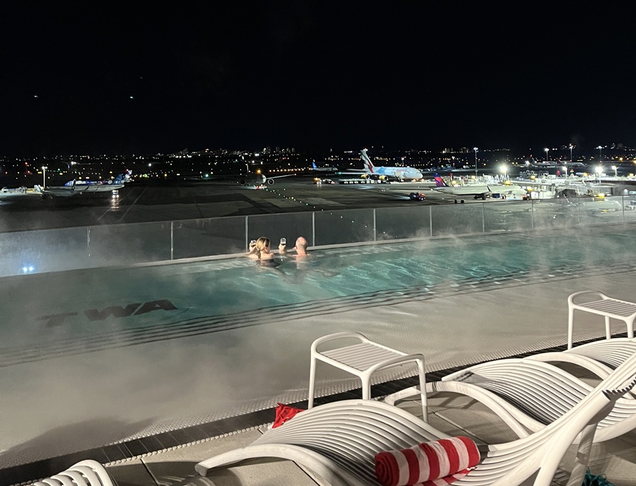 TWA Hotel rooftop pool overlooks JFK runways