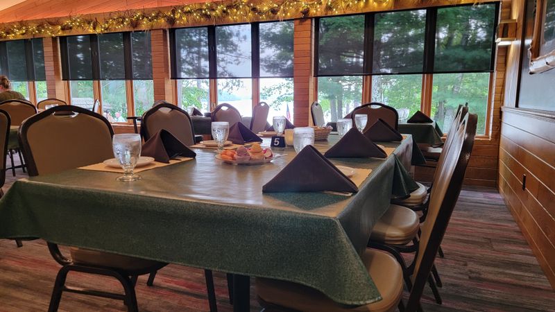 A Lakeside Dining Room with a Front-Row Forest View
