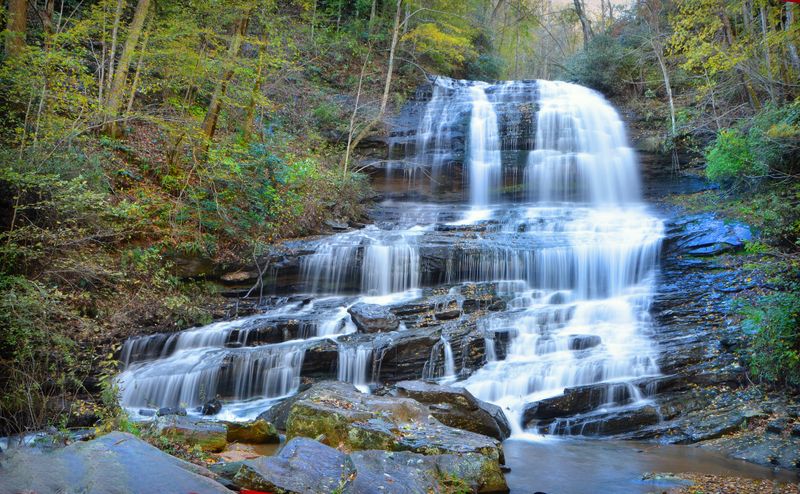 A Foothills Village Surrounded by Waterfalls and Wild Forest