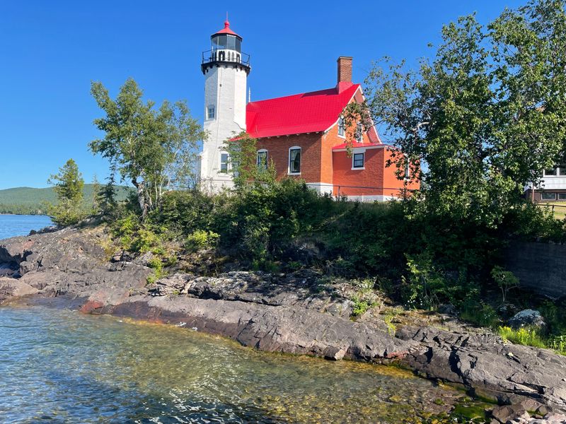 The Lighthouse Above The Harbor