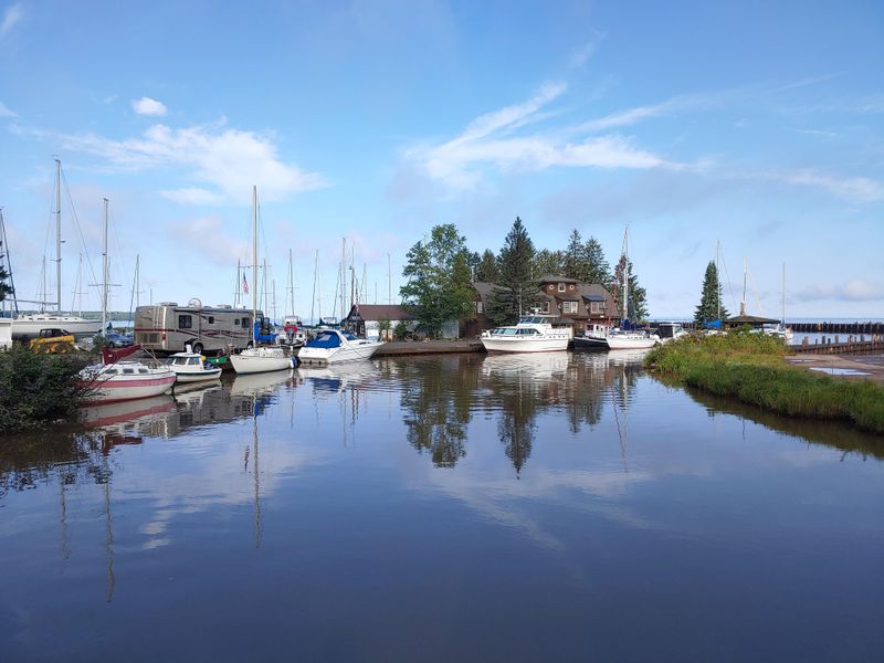 A Natural Harbor Framed By Forest And Water