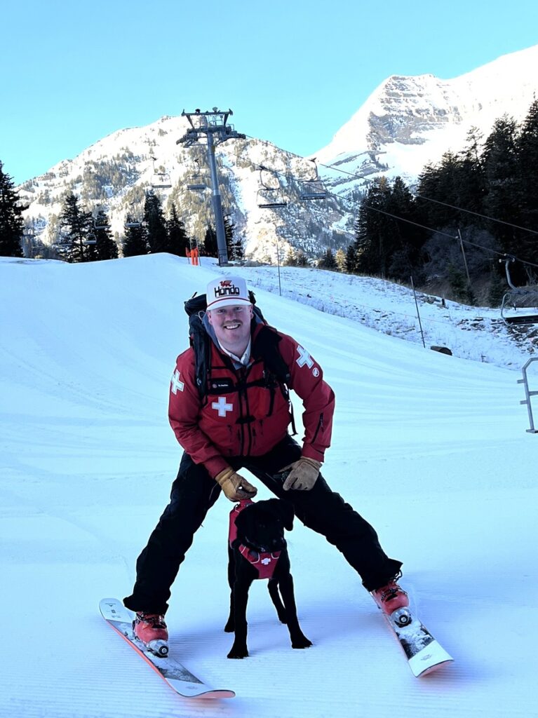 Sundance ski patroller with his 3-month Avalanche Rescue pup Toby