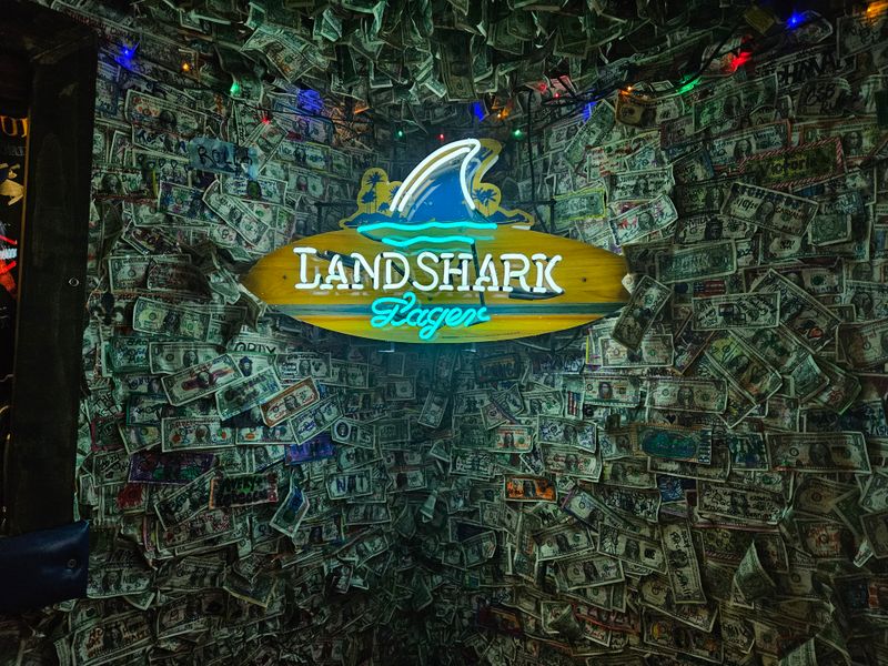 The Walls And Ceilings Are Completely Covered In Signed Dollar Bills