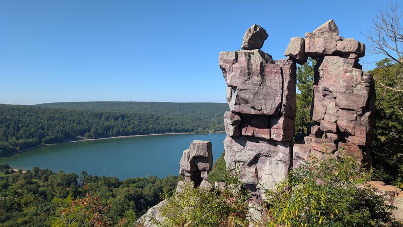 Towering Quartzite Bluffs Rise Hundreds Of Feet Above The Water