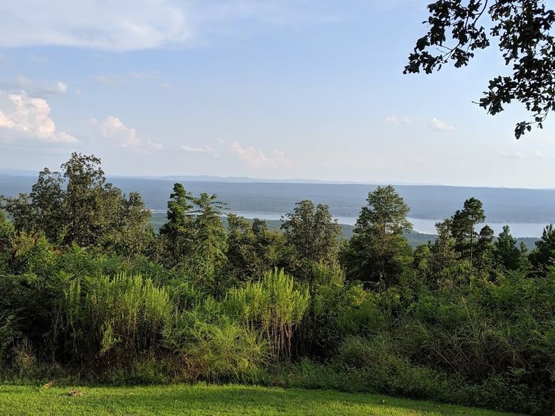 A Lake Surrounded By The Ouachita National Forest