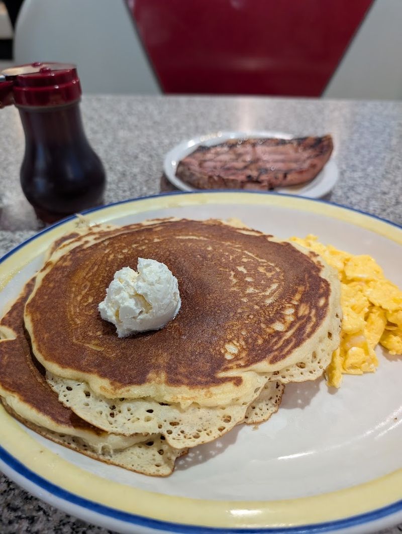 Stacked Pancakes And Omelets That Fill The Entire Plate