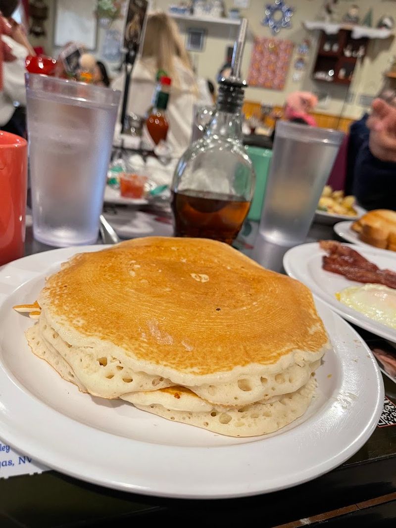 A Menu Filled With Omelets, Pancakes, And Crispy Hash Browns