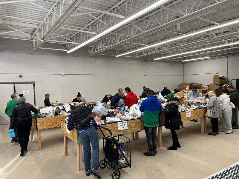 Shoppers Dig Through Bins To Find Hidden Deals