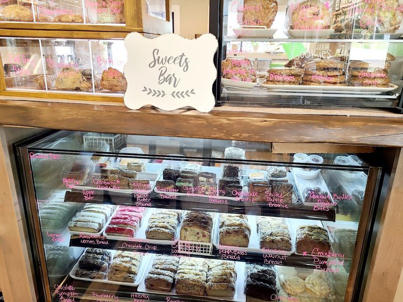 Pastry Counter Filled With Muffins, Scones, And Sweet Treats