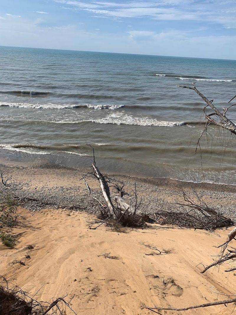 A Stairway Trail Leads Down To The Rocky Shoreline