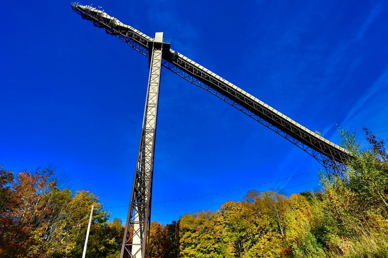 A Towering Structure Rising Above The Forest Near Ironwood