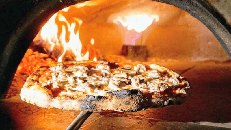 Wood-Fired Pizza Baked In A Massive Italian Oven