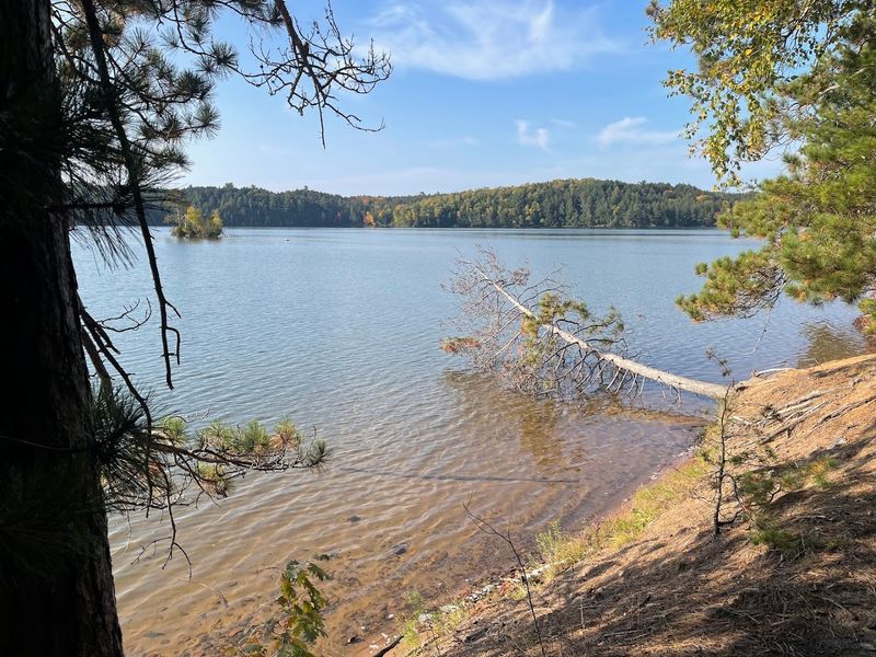 A Quiet Lakeside Beach Waits At The End Of The Hike