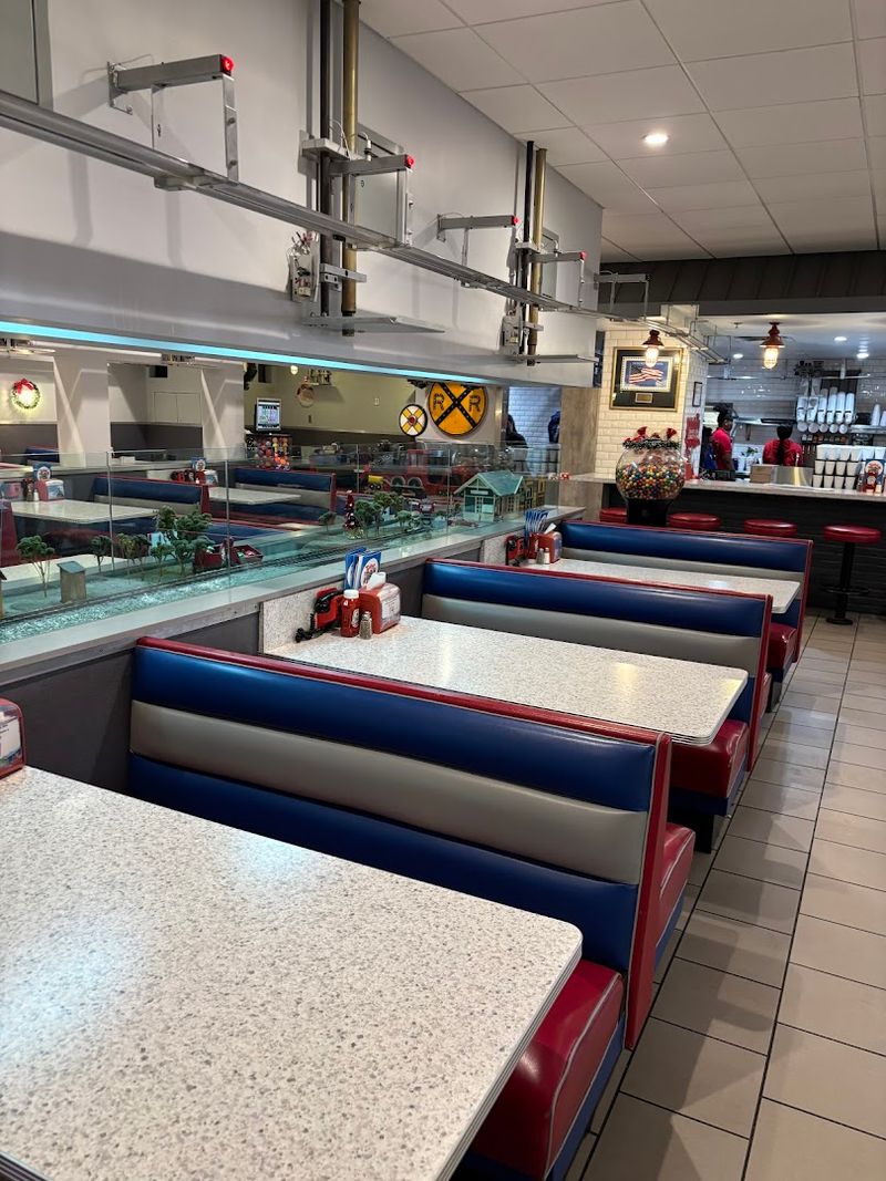 Every Booth Has A Front-Row View Of The Train Tracks