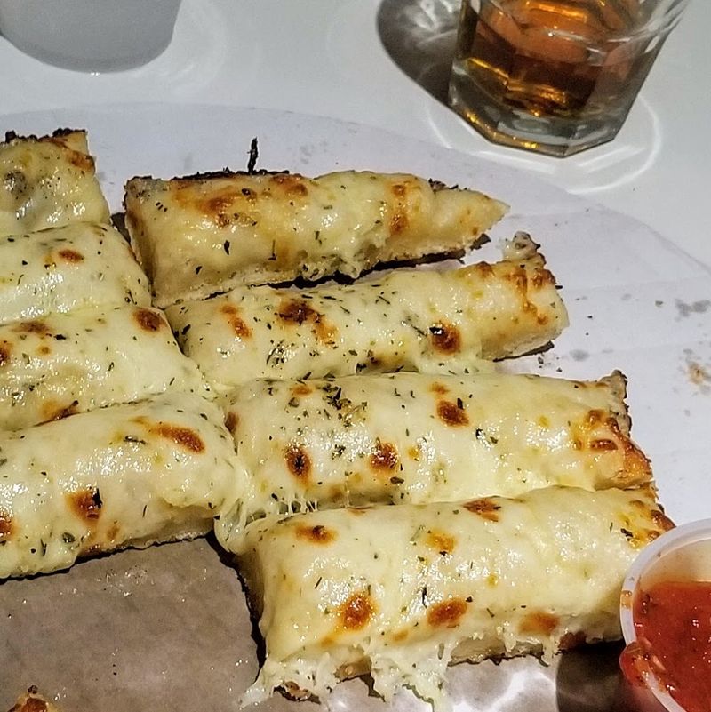 How Garlic Cheesy Bread Became The Must-Order Bite