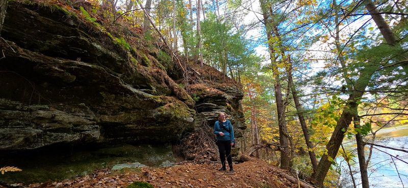 Sandstone Cliffs That Rise Above Calm Reflective Water