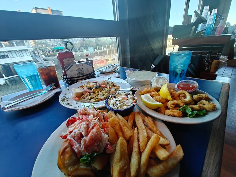 The Floor-To-Ceiling Windows And Harbor Views Inside