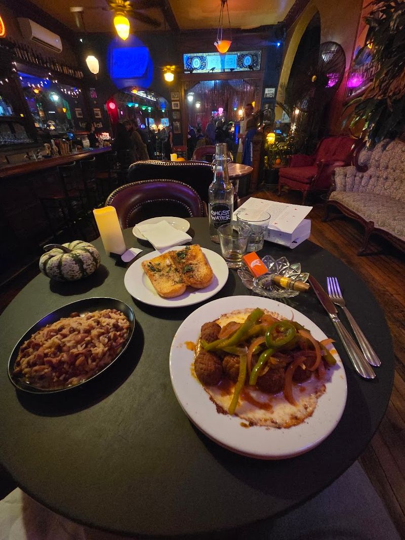 The Lighting And Decor Create That Signature Dark, Moody Atmosphere