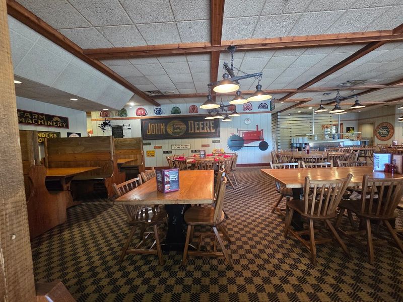 A Rustic Interior Filled With Farm Tools And Vintage Details