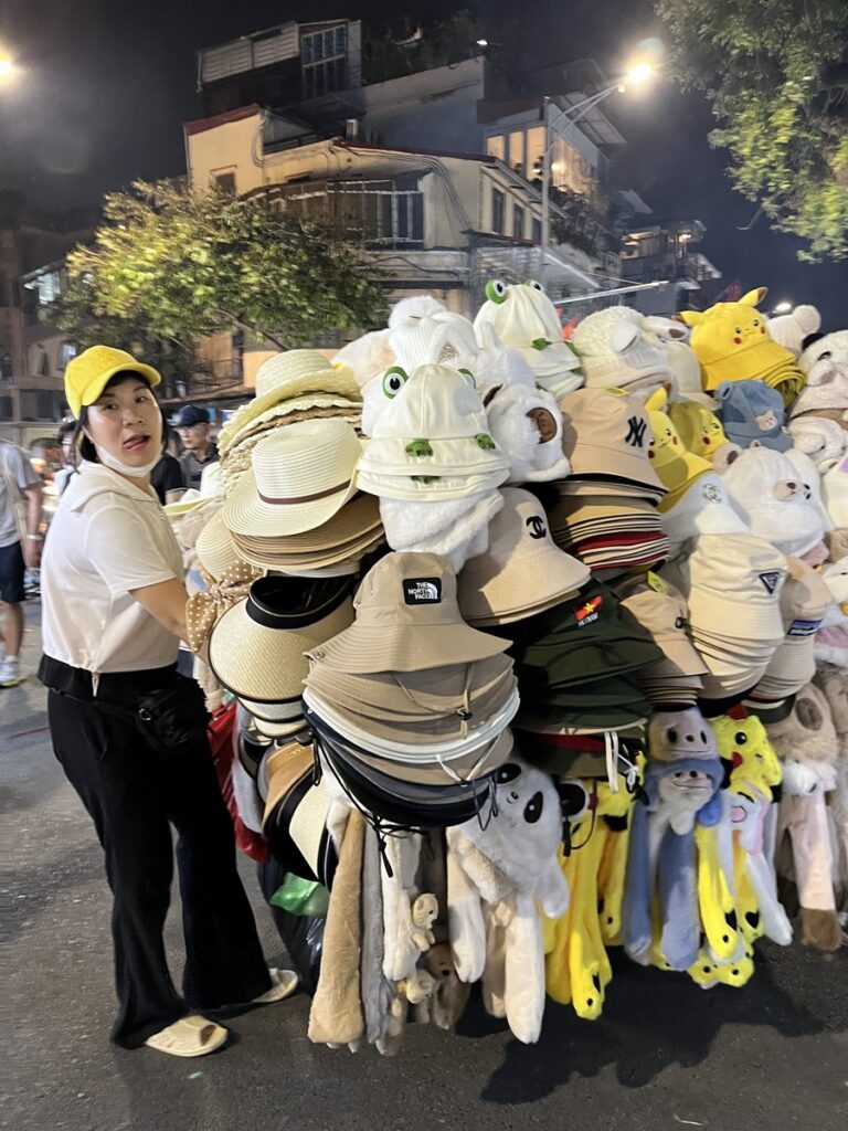 A hat vendor at the Sunday night market in Hanoi