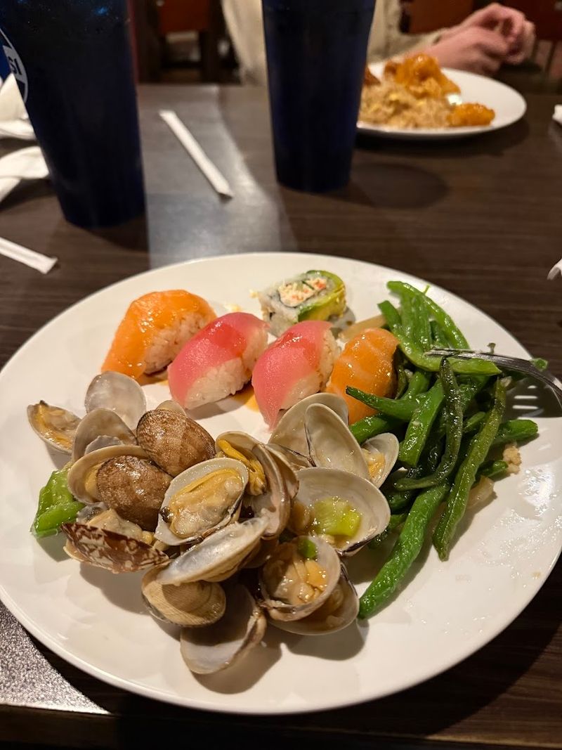 The Buffet Includes Both Asian And American Dishes