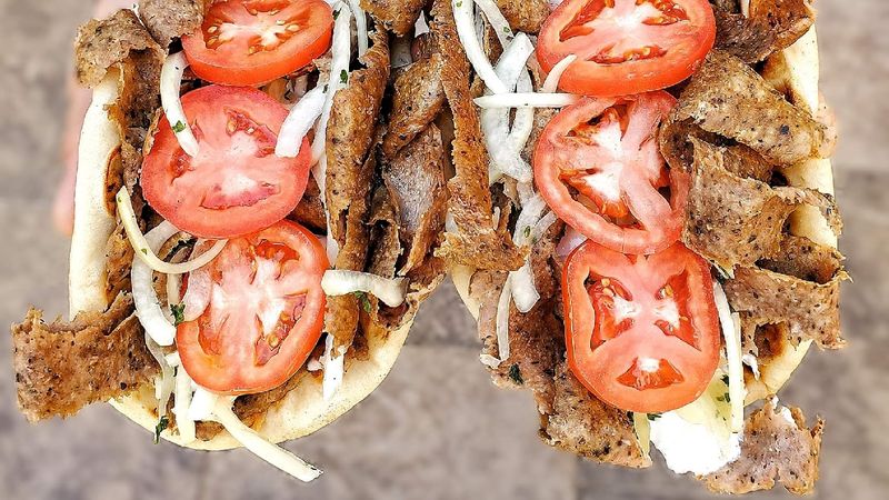 Tender Slices Of Seasoned Gyro Meat Packed Into Warm Pita